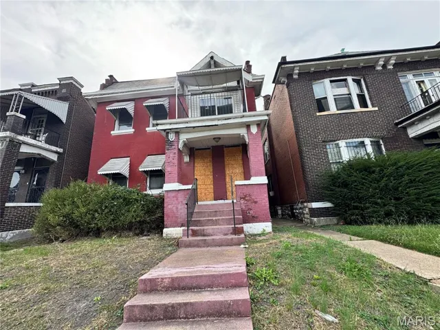 View of front of home with brick siding