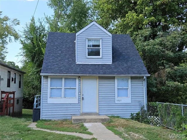 View of front facade with roof with shingles