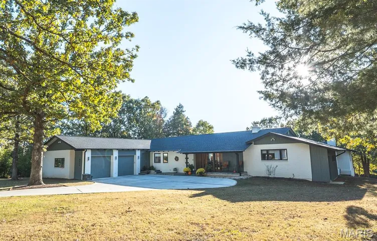 Ranch-style home featuring over 4000 sq ft on main level and 2700 sq ft on lower level finished.
