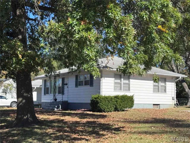 View of home's exterior with a yard