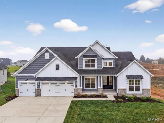 Front Elevation with Stone, Vertical Accent Siding, Architectural Shingle and 3 Car Garage