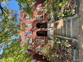 View of front of property with brick siding