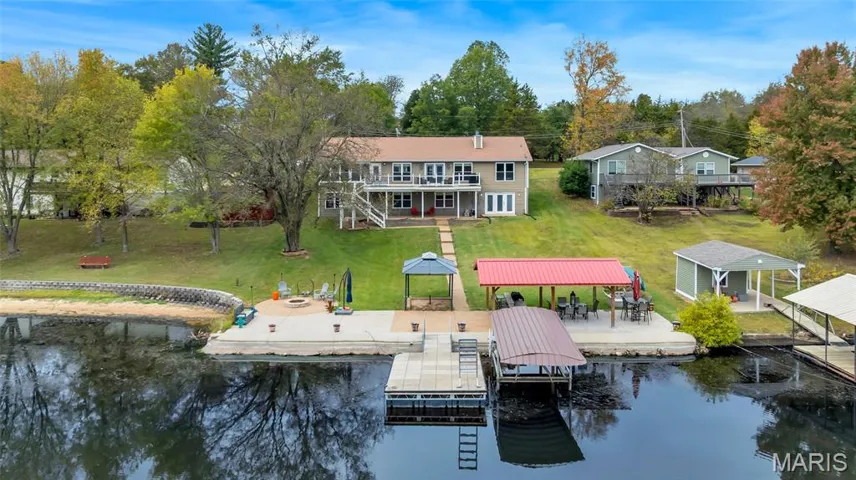 Life on the water, simplified. You get the private dock and boat lift for the adventures, a lush lawn and patio for the community, and a balcony view that reminds you why you moved to the lake in the first place.