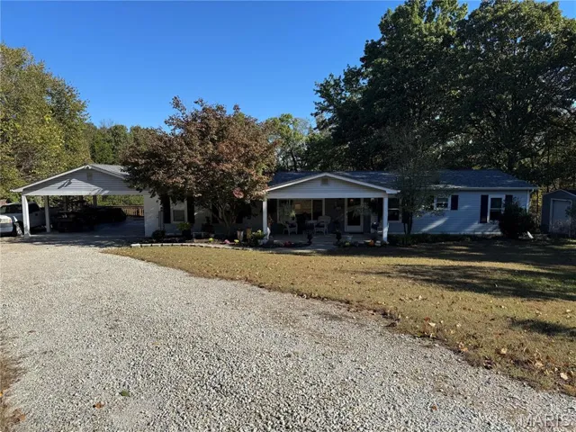 View of primary residence with carport