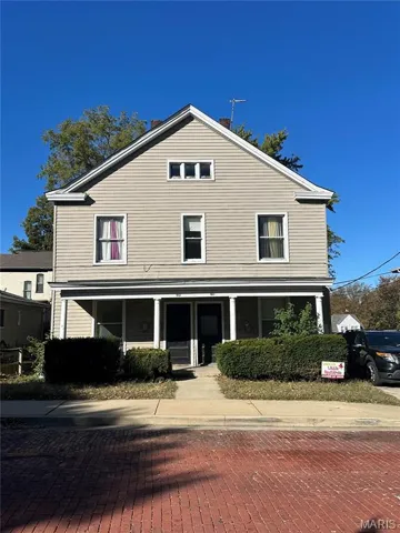 View of front of home with covered porch