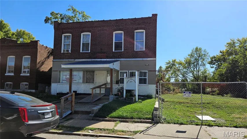 Traditional-style house featuring brick siding