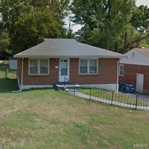 View of front of property with brick siding