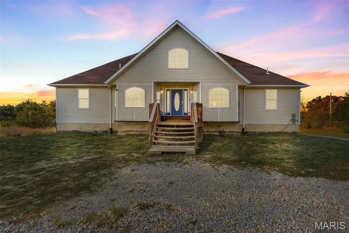View of front of house with a front yard