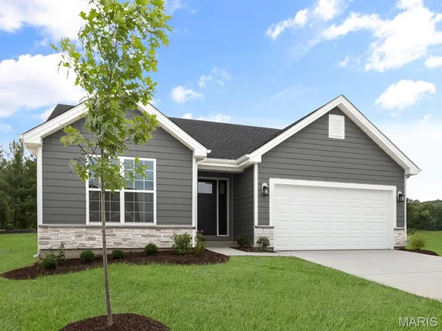 Ranch-style home featuring stone siding, driveway, a front yard, and a garage