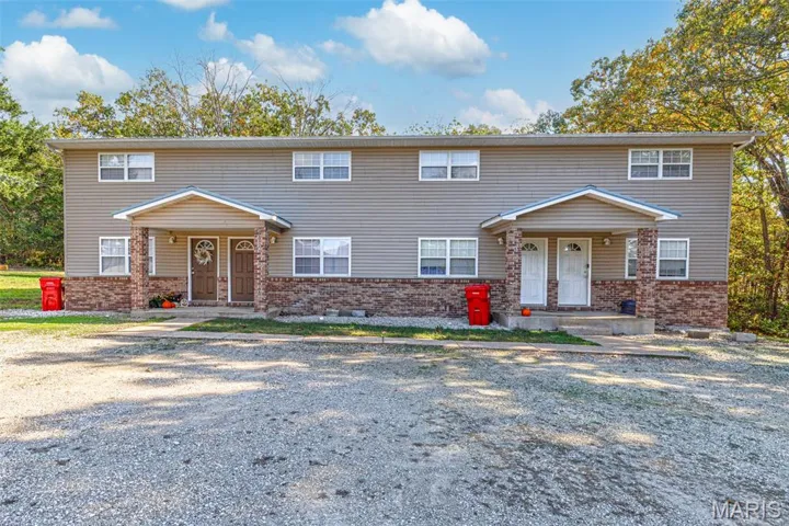 View of front of home with brick siding