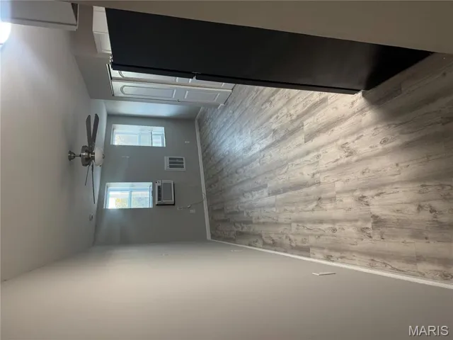 Unfurnished room featuring light wood finished floors and ceiling fan