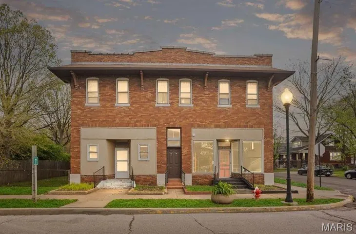 View of front of property featuring brick siding and entry steps