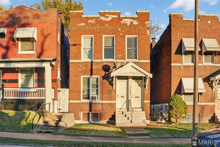View of front of property featuring brick siding and entry steps