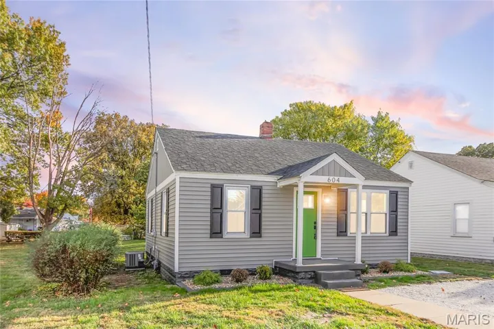 Bungalow with roof with shingles, a chimney, a front yard, and crawl space