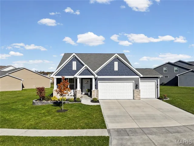 Craftsman-style ranch with a three car garage