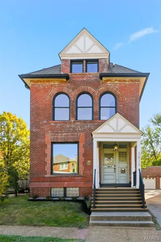 View of front of house featuring brick siding