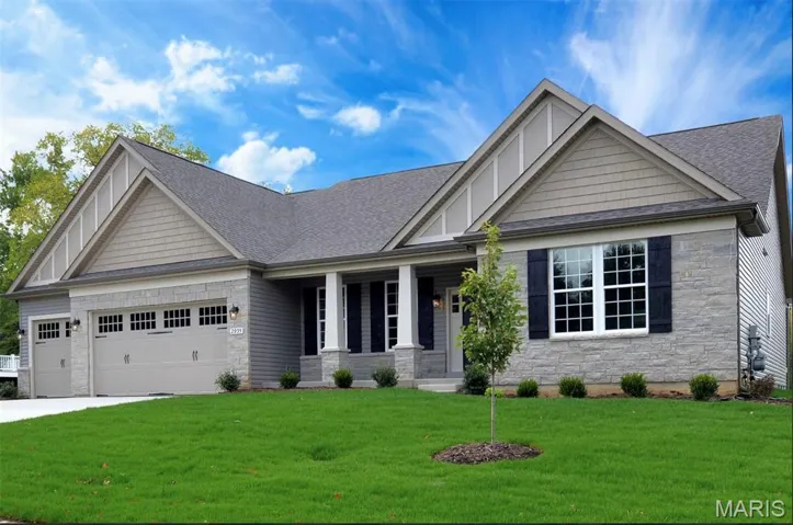 Craftsman house with stone siding, covered porch, a front lawn, and roof with shingles