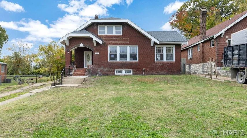 Bungalow-style home featuring brick siding