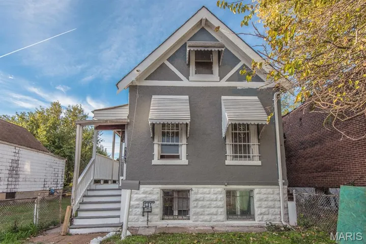 View of front of home featuring stucco siding