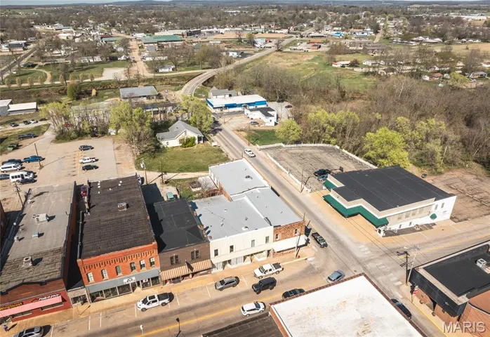 Aerial view of property's location featuring industrial structures
