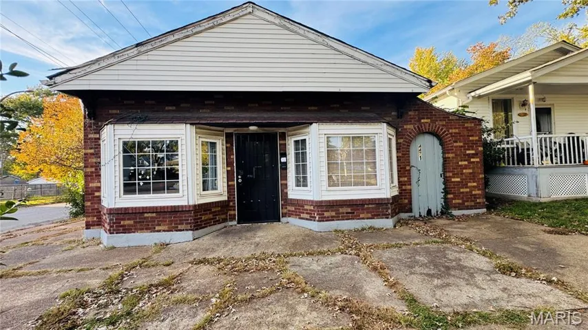 View of front of property featuring brick siding