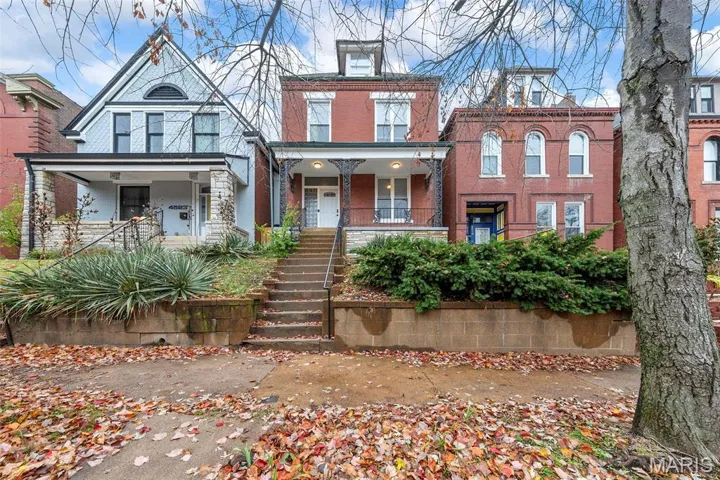 View of front of home featuring a porch and stairs
