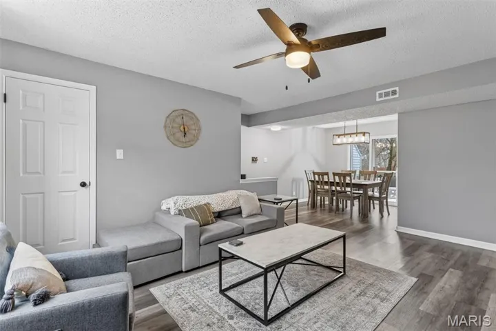 Open-concept living:Family room opens to dining area.