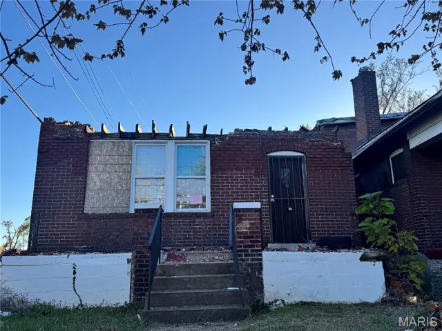View of front of property featuring brick siding