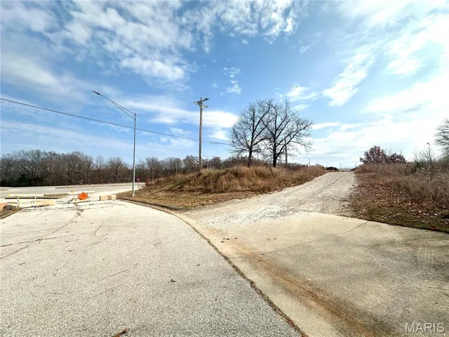 View of asphalt street with curbs