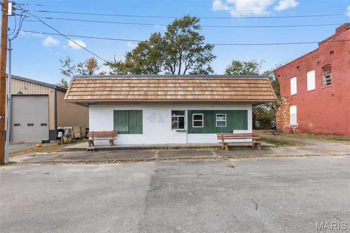 View of front of home with mansard roof