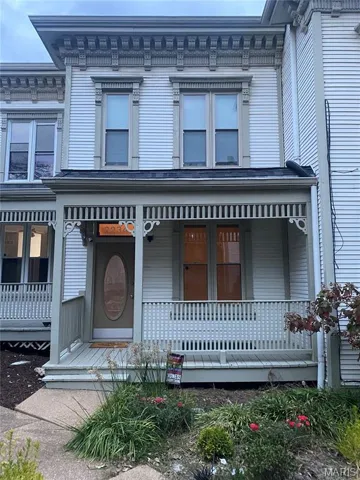 Italianate-style house with covered porch