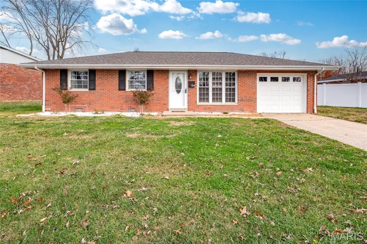 Single story home with brick siding, an attached garage, concrete driveway, and a shingled roof