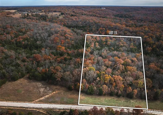 Aerial overview of property's location with property parcel outlined
