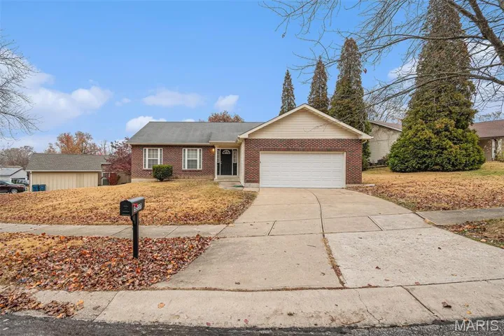 Ranch-style house featuring brick siding, concrete driveway, and a garage