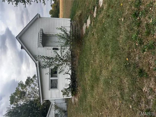 Bungalow-style home featuring a front yard