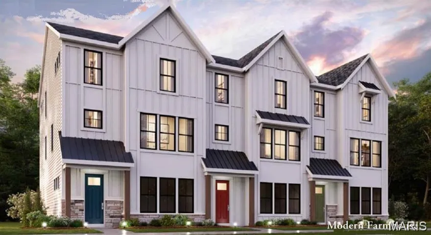 Modern farmhouse with a standing seam roof, a metal roof, and board and batten siding