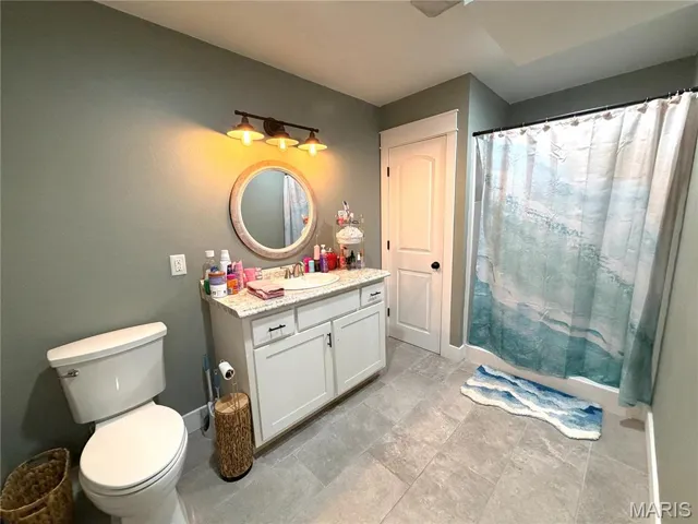 Bathroom featuring vanity and a shower with curtain