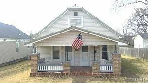 Bungalow-style home with a porch