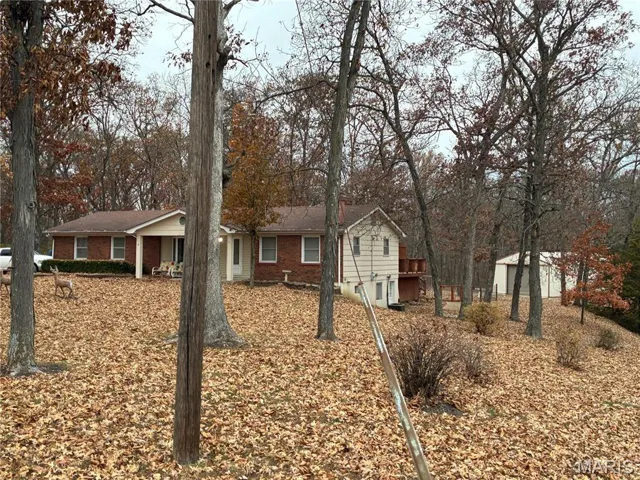 house with large shed in back