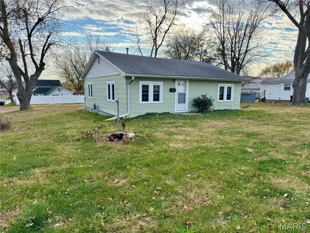 View of front of property with roof with shingles