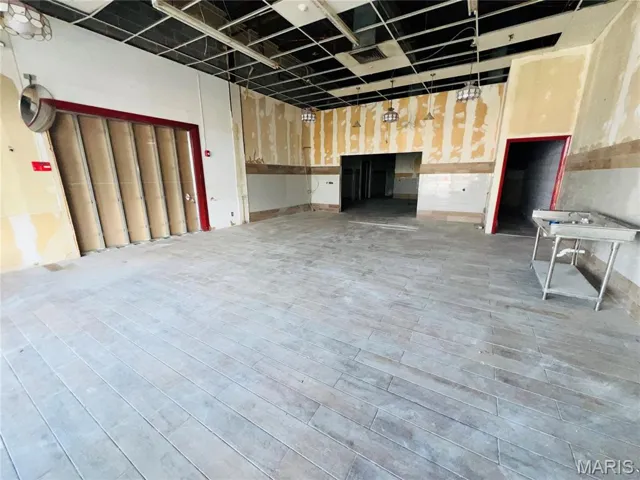 Basement featuring wood finished floors