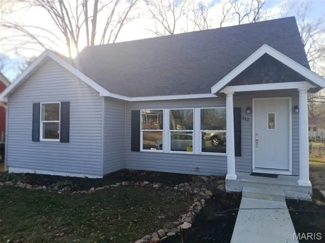 View of front facade with a shingled roof