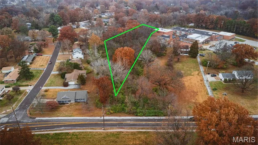 Aerial perspective of suburban area with property boundaries highlighted