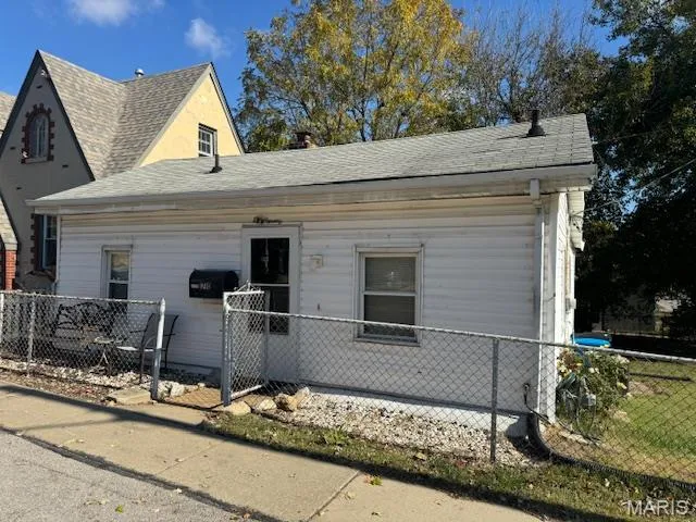 View of front of house featuring roof with shingles
