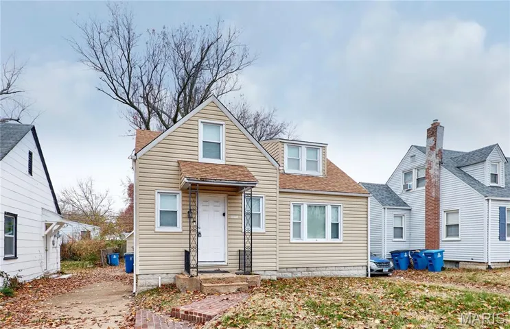 Bungalow-style house with a shingled roof