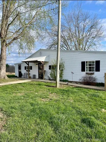 View of front of property with a front yard