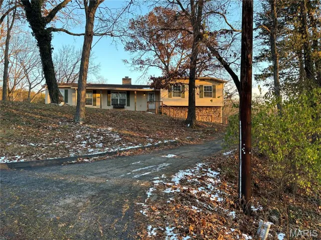 View of front of property featuring a chimney