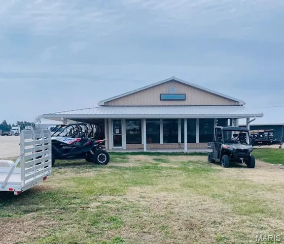 View of property featuring a carport