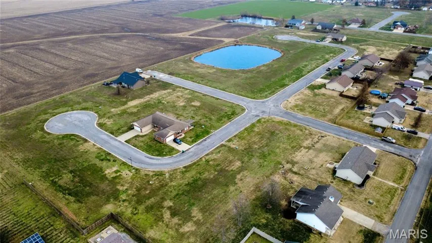 View of property location with a nearby body of water