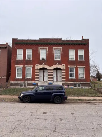 View of front of home featuring brick siding